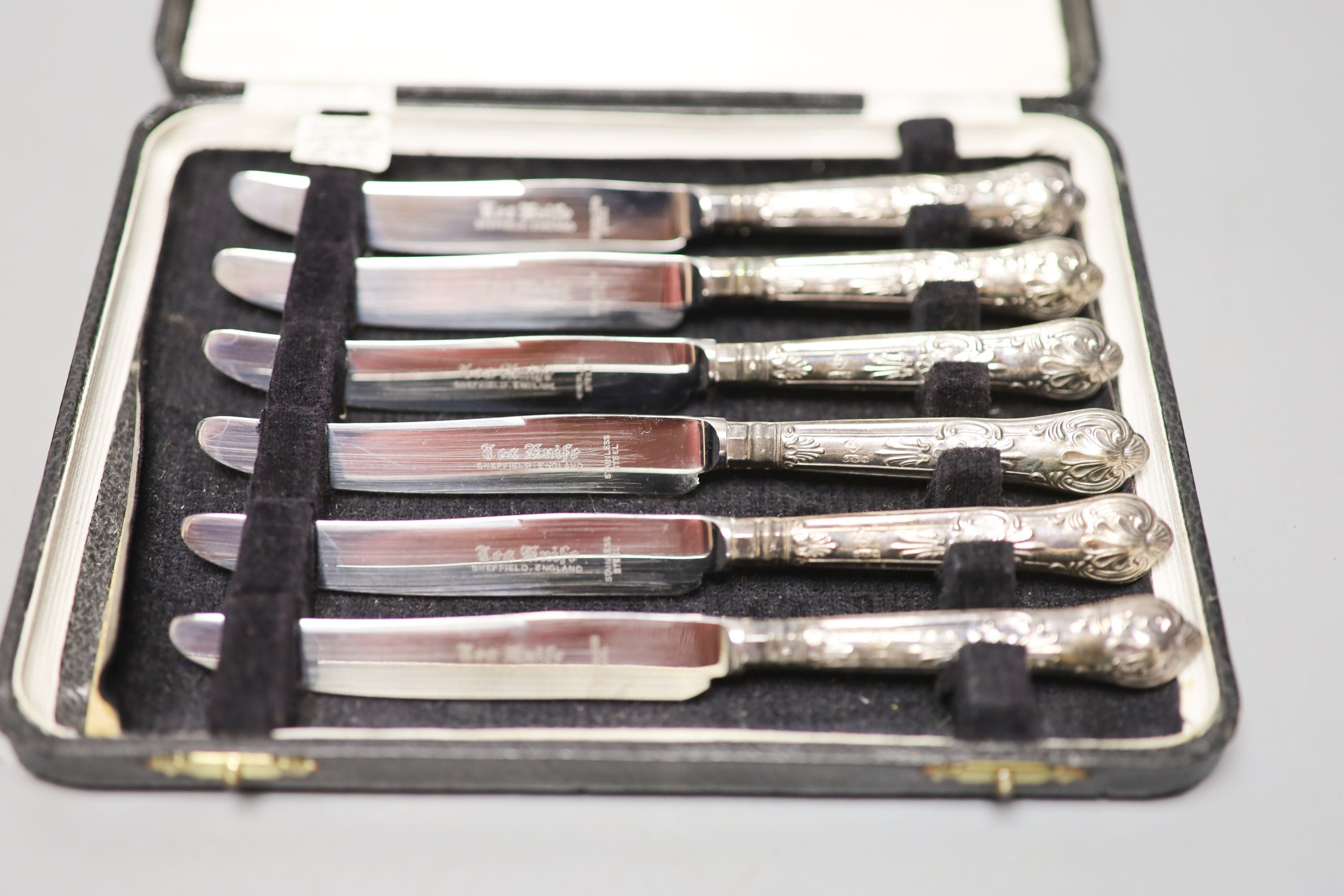 A modern cased set of six silver handled tea knives.